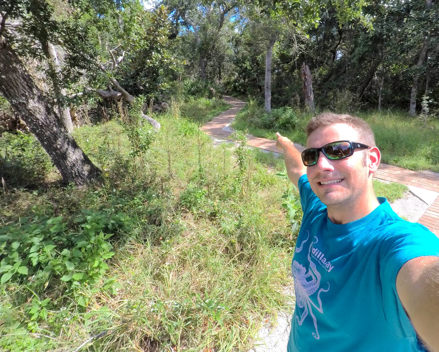 Image of Kenneth pointing to the pervious trail.